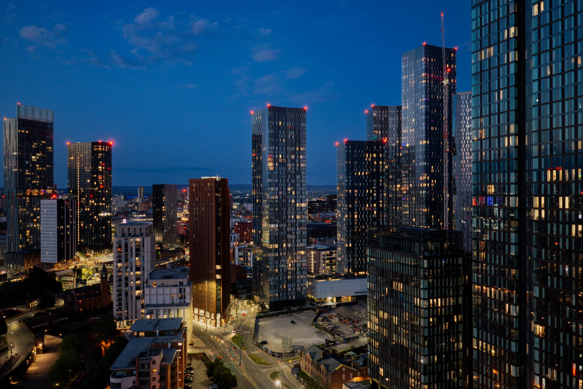 UK city skyline at dusk with modern residential towers